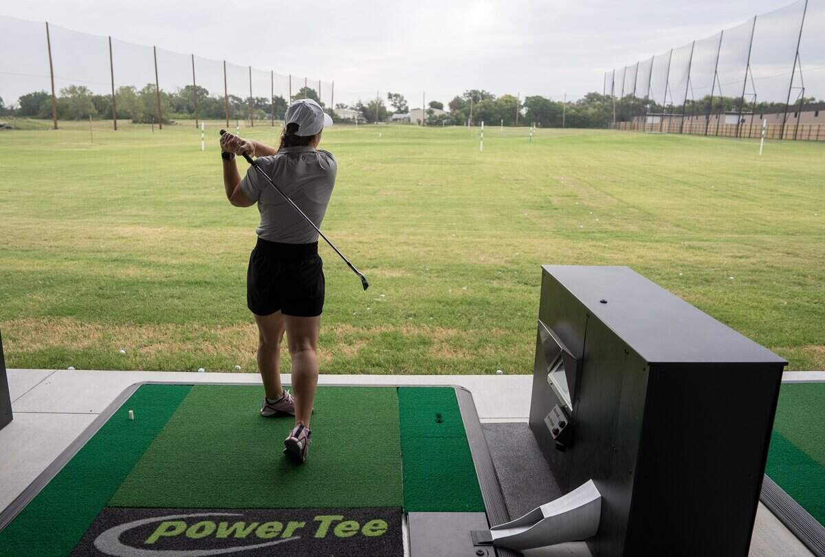 Sheila Atchison, Director of Team Development for Mammoth Clubhouse, demonstrates hitting from one of their bays. Mammoth Clubhouse is located at 950 N. Webb Road at the former All Star Adventures property.